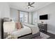 Bedroom with ceiling fan, balcony access, and stylish furnishings at 384 Blowing Fresh Dr, Charleston, SC 29492