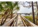 Picturesque boardwalk leading to waterfront gazebos, providing a tranquil pathway to the serene waters at 384 Blowing Fresh Dr, Charleston, SC 29492