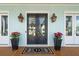 Charming front entry with double doors, outdoor lanterns, and potted flowers, creating a welcoming curb appeal at 384 Blowing Fresh Dr, Charleston, SC 29492