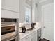 Modern kitchen area with stainless steel appliances, wine cooler, and bright lighting at 384 Blowing Fresh Dr, Charleston, SC 29492