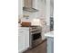 Modern kitchen features stainless steel appliances and white cabinetry at 384 Blowing Fresh Dr, Charleston, SC 29492