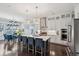 Open concept kitchen with a large island, modern stainless appliances, and pendant lighting at 384 Blowing Fresh Dr, Charleston, SC 29492