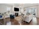 Well-lit living room featuring fireplace and access to a screened-in porch at 384 Blowing Fresh Dr, Charleston, SC 29492