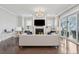 Staged living room showing furniture and decor, fireplace, and water view at 384 Blowing Fresh Dr, Charleston, SC 29492