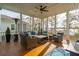 Comfortable screened-in porch with outdoor seating overlooking a lake at 384 Blowing Fresh Dr, Charleston, SC 29492