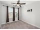 This bedroom features natural light from the window and a ceiling fan at 407 Stoneleigh Ln, Moncks Corner, SC 29461