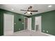 Bedroom featuring an ensuite bathroom, a walk-in closet, and a ceiling fan at 407 Stoneleigh Ln, Moncks Corner, SC 29461