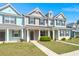 Colorful townhomes boast vibrant exteriors, lush green lawns, and inviting covered front porches at 407 Stoneleigh Ln, Moncks Corner, SC 29461