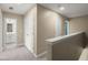 Upstairs hallway featuring neutral walls, carpet, and a view into a bathroom at 407 Stoneleigh Ln, Moncks Corner, SC 29461