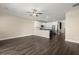 Open concept living room and kitchen with dark wood flooring, great for entertaining at 407 Stoneleigh Ln, Moncks Corner, SC 29461