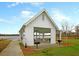 Lakefront pavilion with picnic tables and grill provides a picturesque setting for outdoor gatherings at 407 Stoneleigh Ln, Moncks Corner, SC 29461