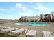 Enjoy a relaxing swim in the community pool with plenty of lounge chairs and a lakeside view at 407 Stoneleigh Ln, Moncks Corner, SC 29461