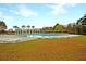 Community swimming pool with lounge chairs, white pergola, and natural surroundings at 407 Stoneleigh Ln, Moncks Corner, SC 29461