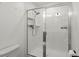 Modern walk-in shower with sleek glass doors and subway tile surround at 407 Stoneleigh Ln, Moncks Corner, SC 29461