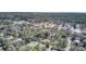Overhead view capturing a neighborhood with a mix of homes, businesses, and wooded areas at 409 Klein St, Walterboro, SC 29488