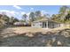 Well-maintained backyard with a spacious lawn and a covered patio, perfect for outdoor gatherings at 409 Klein St, Walterboro, SC 29488