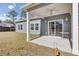 Backyard showcasing a covered patio, a well-maintained lawn, and ample outdoor space to enjoy at 409 Klein St, Walterboro, SC 29488
