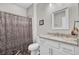 Bathroom featuring a modern single sink vanity and a shower with decorative curtain at 409 Klein St, Walterboro, SC 29488