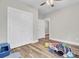 Bedroom featuring modern doors and wood-look floors, a perfect space to unwind and relax at 409 Klein St, Walterboro, SC 29488