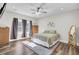 Bright bedroom features hardwood floors, a ceiling fan, and neutral colors, creating a calming atmosphere at 409 Klein St, Walterboro, SC 29488