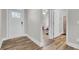 Clean entryway with a white door, views of a bedroom, and a bathroom at 409 Klein St, Walterboro, SC 29488
