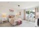 A cozy bedroom features a plush bed, a desk by the window, and modern decor at 421 Grove End Rd, Moncks Corner, SC 29461