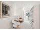 A hallway boasts built-in shelving, plush chairs, and a charming window that adds character at 421 Grove End Rd, Moncks Corner, SC 29461