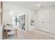 A bright, carpeted hallway featuring white built-in shelving leads to the bedrooms at 421 Grove End Rd, Moncks Corner, SC 29461