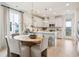 Eat-in kitchen features white cabinetry, modern lighting, and stainless steel appliances at 421 Grove End Rd, Moncks Corner, SC 29461