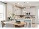 Eat-in kitchen features modern pendant lighting, a round table, and updated stainless steel appliances at 421 Grove End Rd, Moncks Corner, SC 29461