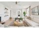 Bright, open living room with cozy seating, stylish decor, and views into other rooms at 421 Grove End Rd, Moncks Corner, SC 29461