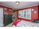 Bedroom features a window letting in plenty of light, red walls, and light-toned carpet at 562 Fort Johnson Rd, Charleston, SC 29412
