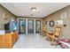 Inviting entrance area featuring tiled floors, rocking chairs, and decorative doors at 562 Fort Johnson Rd, Charleston, SC 29412