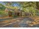 Charming brick home with mature trees, a private driveway and lush greenery all around the property at 562 Fort Johnson Rd, Charleston, SC 29412