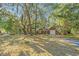 Charming brick home with mature trees, a private driveway and lush greenery all around the property at 562 Fort Johnson Rd, Charleston, SC 29412