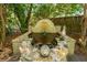 Outdoor fountain with stone accents surrounded by lush landscaping creates a serene backyard focal point at 562 Fort Johnson Rd, Charleston, SC 29412
