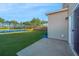 Lush backyard featuring a serene pond view and a charming wooden fence at 607 Silver Spruce St, Summerville, SC 29486