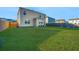 Spacious backyard with lush green grass and a wooden fence for privacy at 607 Silver Spruce St, Summerville, SC 29486