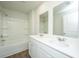 Well-lit bathroom with a double sink vanity, large mirror, and shower-tub combo at 607 Silver Spruce St, Summerville, SC 29486