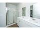 Modern bathroom featuring double sink vanity with white cabinetry and a glass-enclosed shower at 607 Silver Spruce St, Summerville, SC 29486
