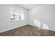 Bright bedroom features a large window and stylish wood-look flooring at 607 Silver Spruce St, Summerville, SC 29486