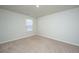 Bedroom featuring neutral carpet, white walls, and a window for ample natural light at 607 Silver Spruce St, Summerville, SC 29486