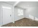 Bright foyer with wood floors, white walls, and natural light from the window at 607 Silver Spruce St, Summerville, SC 29486