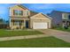 Attractive two-story home with a manicured lawn and an attached two-car garage at 607 Silver Spruce St, Summerville, SC 29486