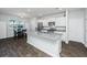 Spacious kitchen with granite countertops, island, stainless appliances, and an adjacent dining area at 607 Silver Spruce St, Summerville, SC 29486
