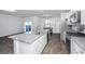 Well-lit kitchen features granite countertops, stainless appliances, island, and dining nook with a view at 607 Silver Spruce St, Summerville, SC 29486