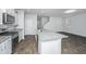 Bright kitchen features granite countertops, stainless appliances, and an island perfect for entertaining at 607 Silver Spruce St, Summerville, SC 29486