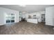 Open concept living space with view to the kitchen and outdoor access at 607 Silver Spruce St, Summerville, SC 29486