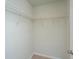 Walk-in closet featuring a wire shelving system and neutral carpet at 607 Silver Spruce St, Summerville, SC 29486