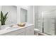 Bright bathroom featuring a double sink, a large mirror, and a glass-enclosed shower at 6226 Gritman Dr, Hollywood, SC 29470